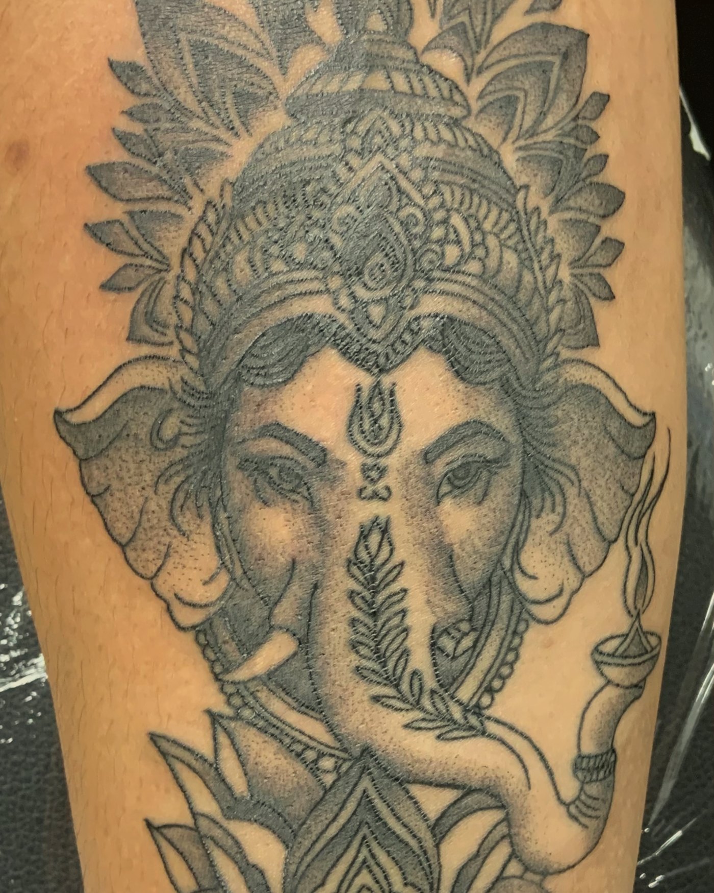 Black & grey Ganesh on the forearm — by Edwin Delarosa, Crown Ink Studio Brooklyn