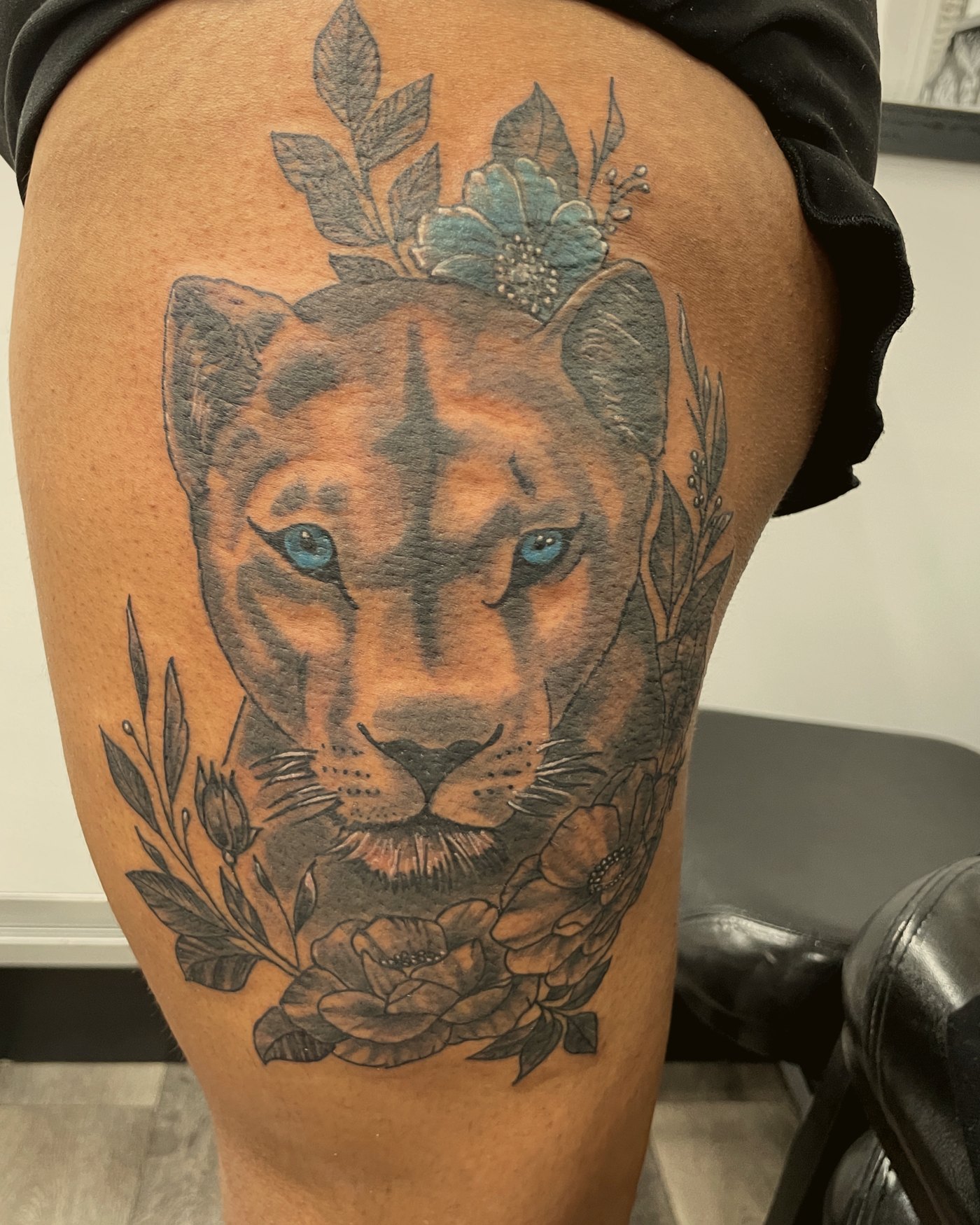 Lioness with florals on the thigh — by Paul Aroca, Crown Ink Studio Brooklyn