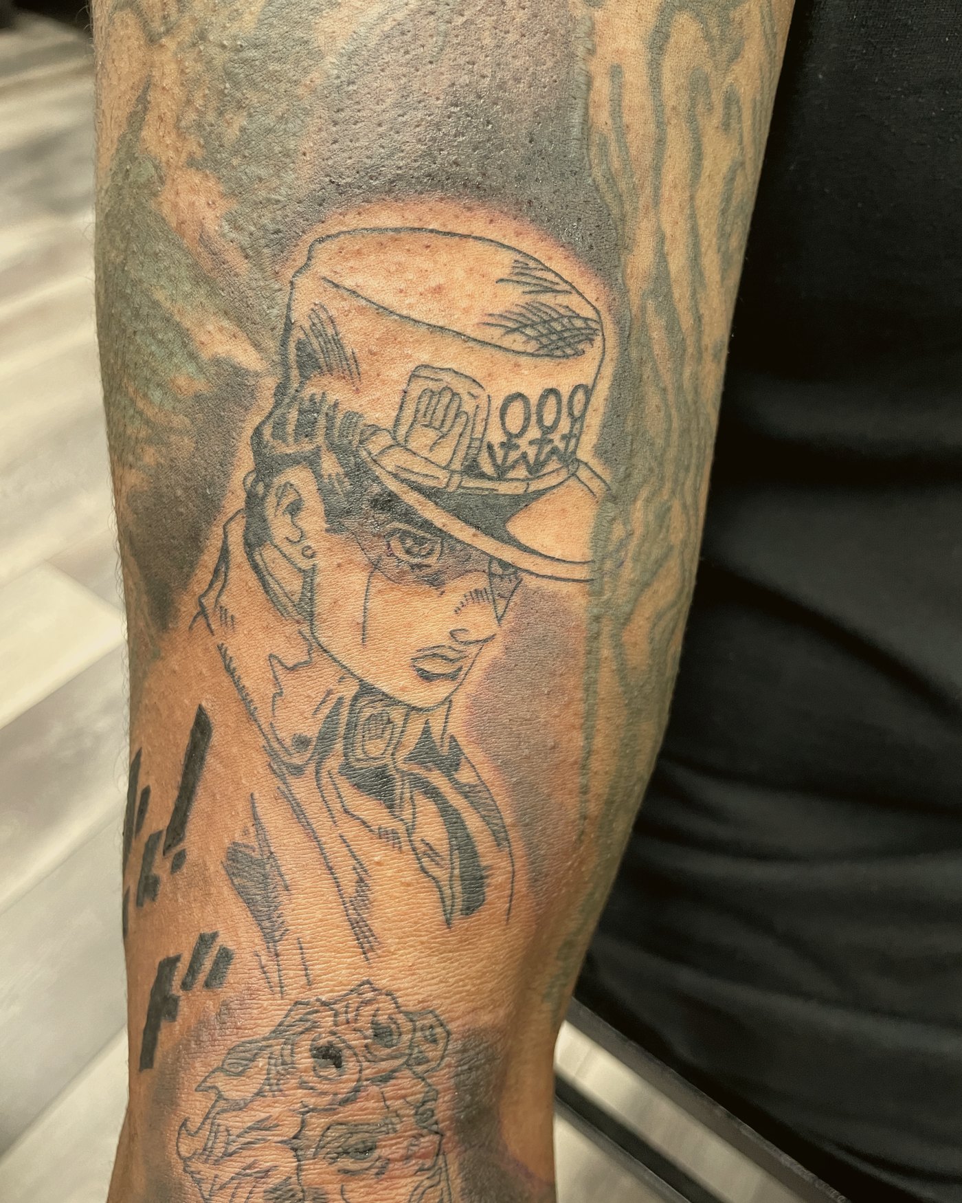 Character portrait, black & grey, upper arm — by Paul Aroca, Crown Ink Studio Brooklyn