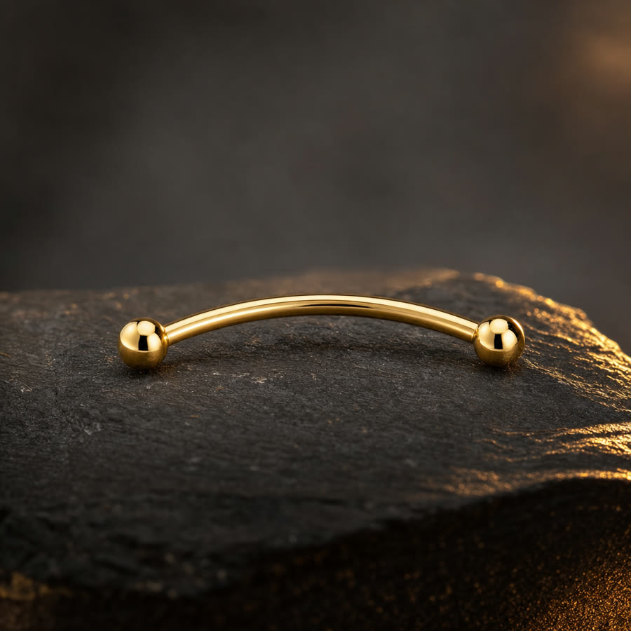 Curved Eyebrow Barbell — 14k gold · 16g · 8mm — Crown Ink Studio jewelry, Brooklyn