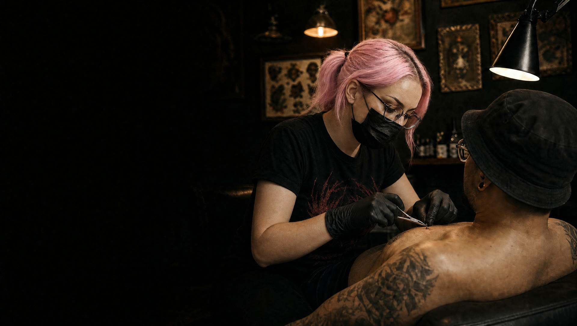 Piercer fitting gold jewelry at Crown Ink Studio, Brooklyn